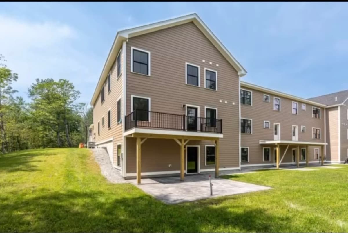Three story multi-family building exterior painted on a staged schedule