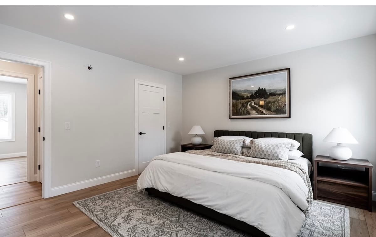 Bedroom with new baseboard enamel and repainted walls