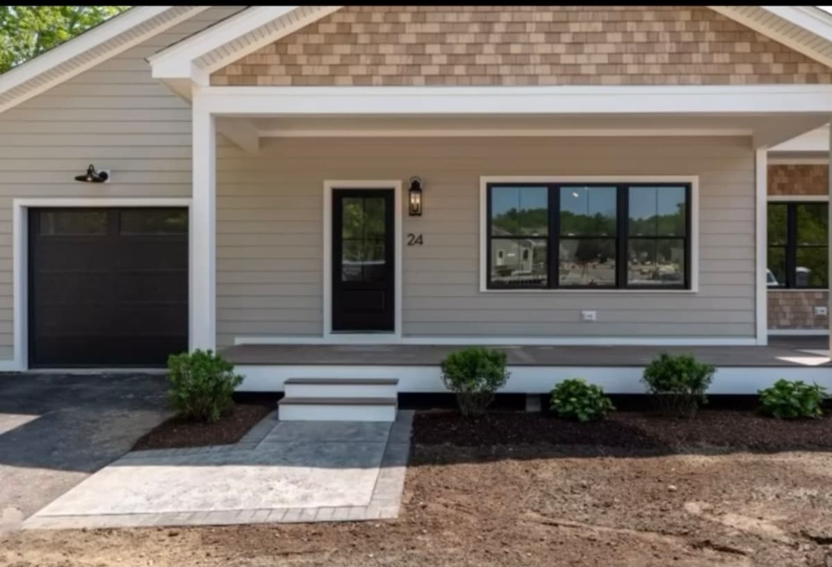 Ranch home with attached garage after exterior painting in Hampton, NH